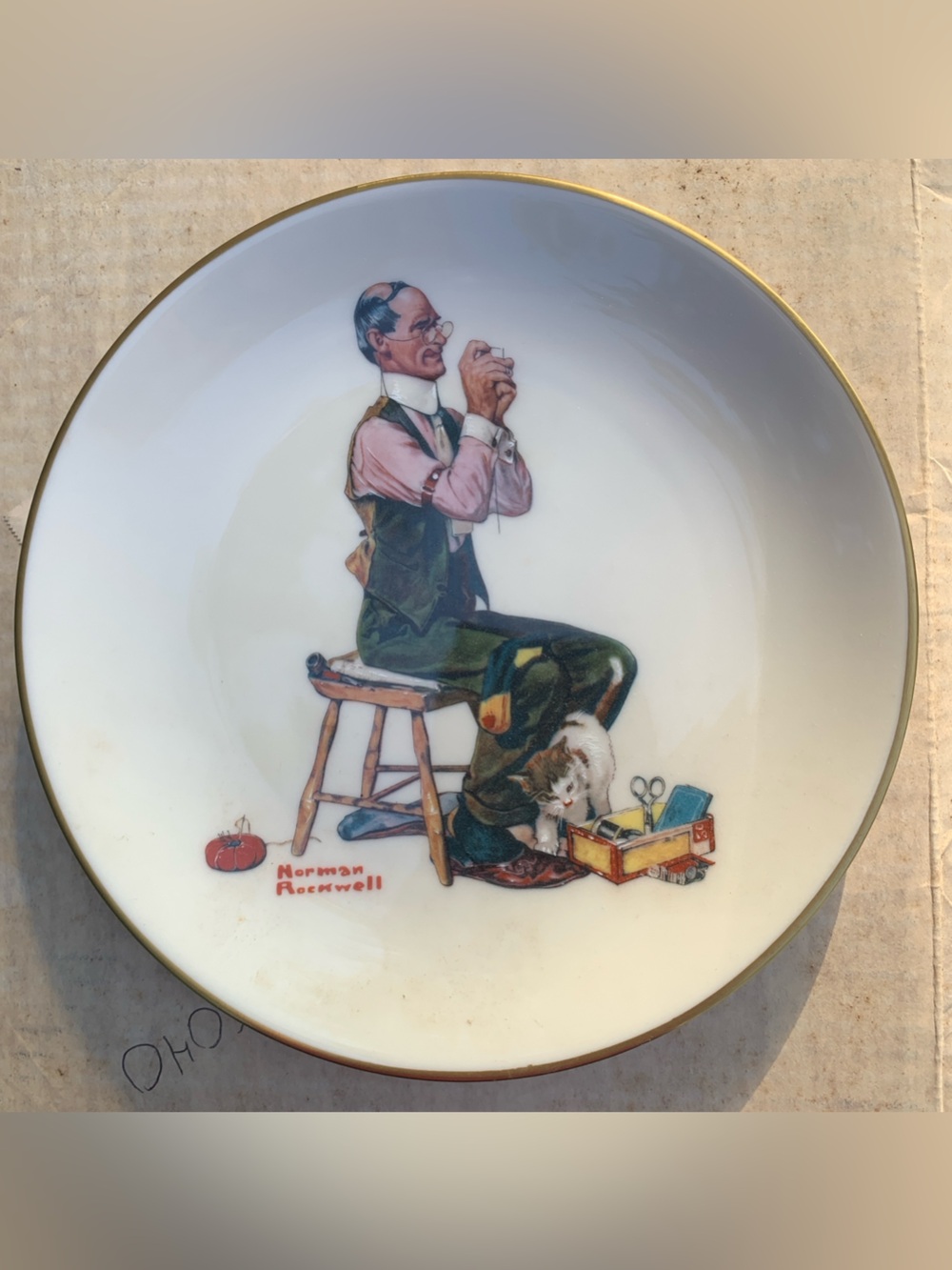 Norman Rockwell Ceramic Plate. Man threading the needle.
